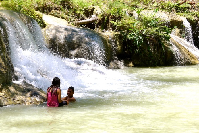 Lovers bathe at the 2nd tier of the Cambugahay Falls, Lazi, Siquijor. Photo: Fr. Jboy Gonzales SJ